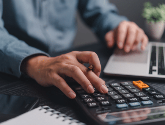 A person using a calculator