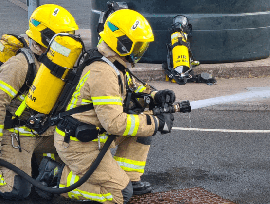 Two apprentice firefighters completing their end-point assessment