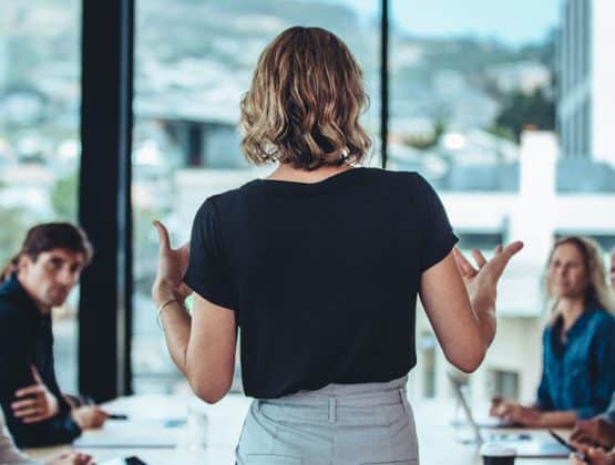 Woman leading a team meeting in an office setting