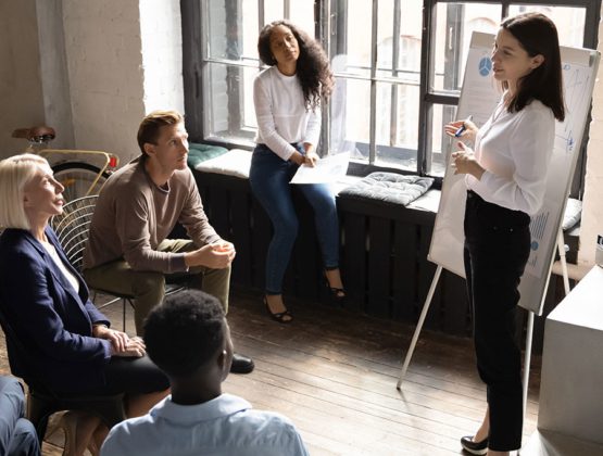 Woman leading a meeting in an office setting