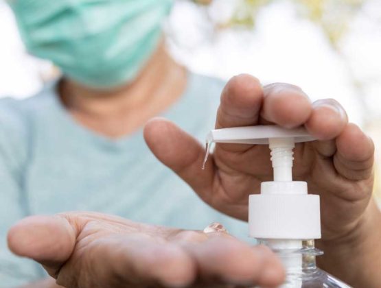 Someone using hand sanitizer