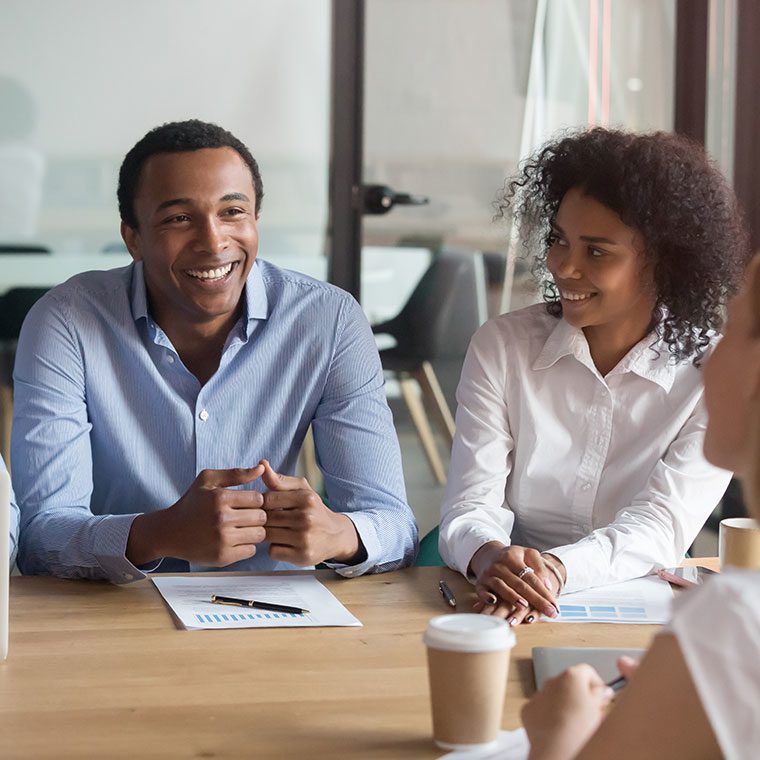 Team of colleagues working together in a meeting