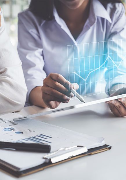 Two office workers looking at some paperwork