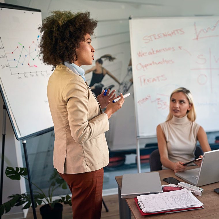 Woman leading a meeting with a group of colleagues