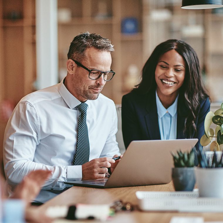 Two colleagues working together in an office
