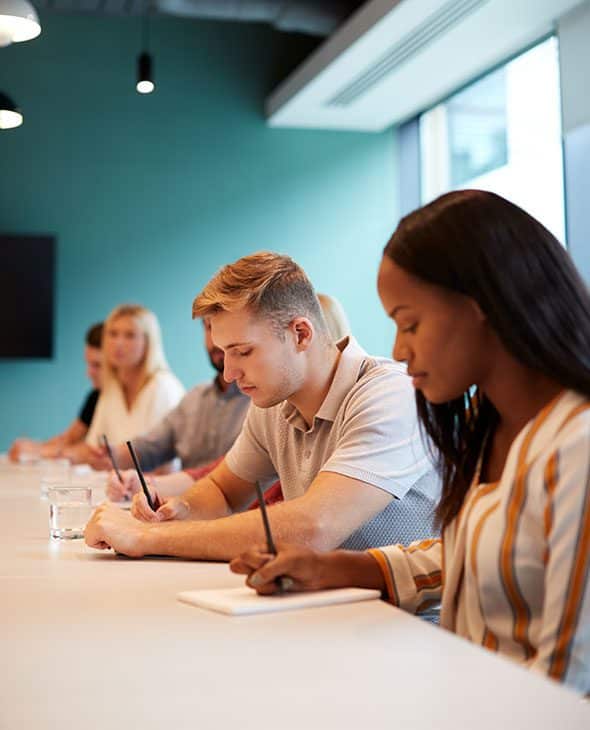 Group of apprentices listening in a classroom