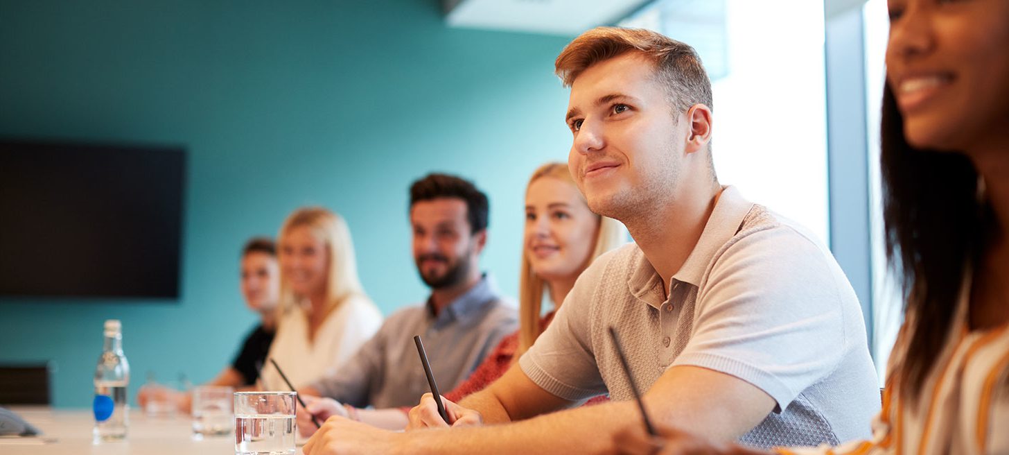 Group of apprentices listening in a classroom