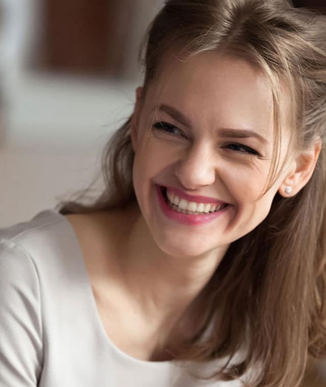 Woman smiling at colleagues