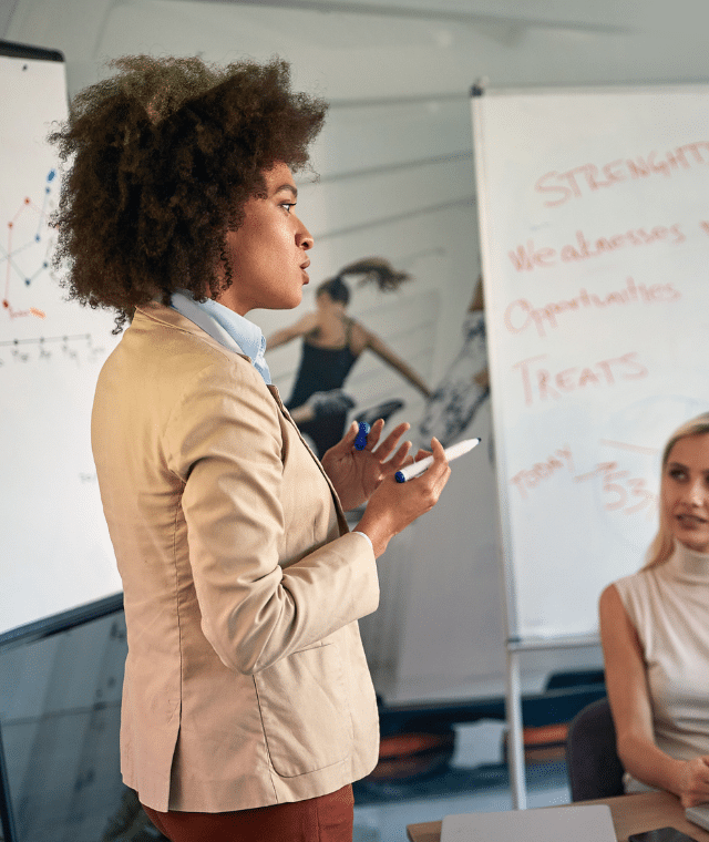 Woman leading meeting with colleagues