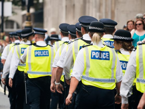 A group of police officers walking together in a public space