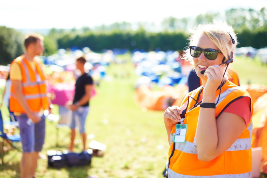 Woman working at a public event as event staff.