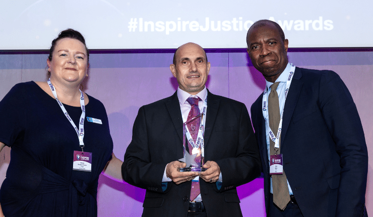 Matthew Bysouth receiving an Inspire Justice Award in 2024