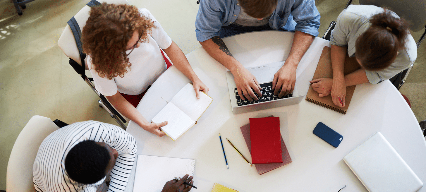 A group of people working at a table
