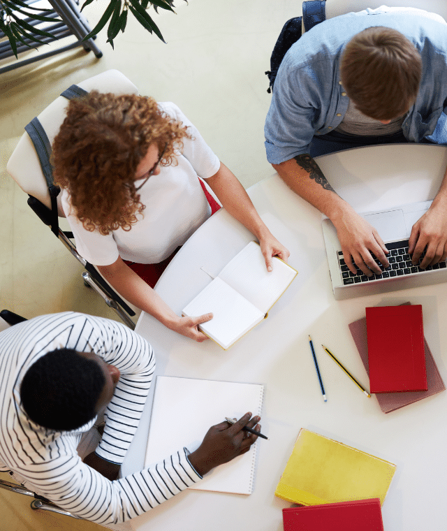 A group of people working at a table