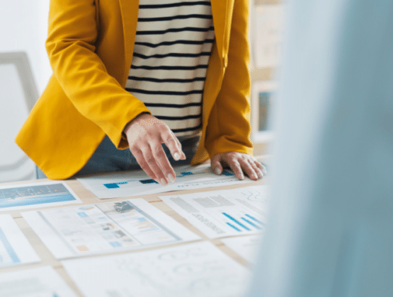 A person looking over pages of information