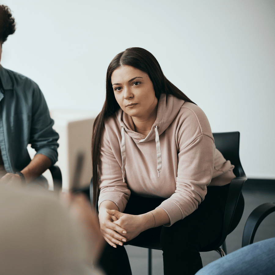 Woman sitting in a group