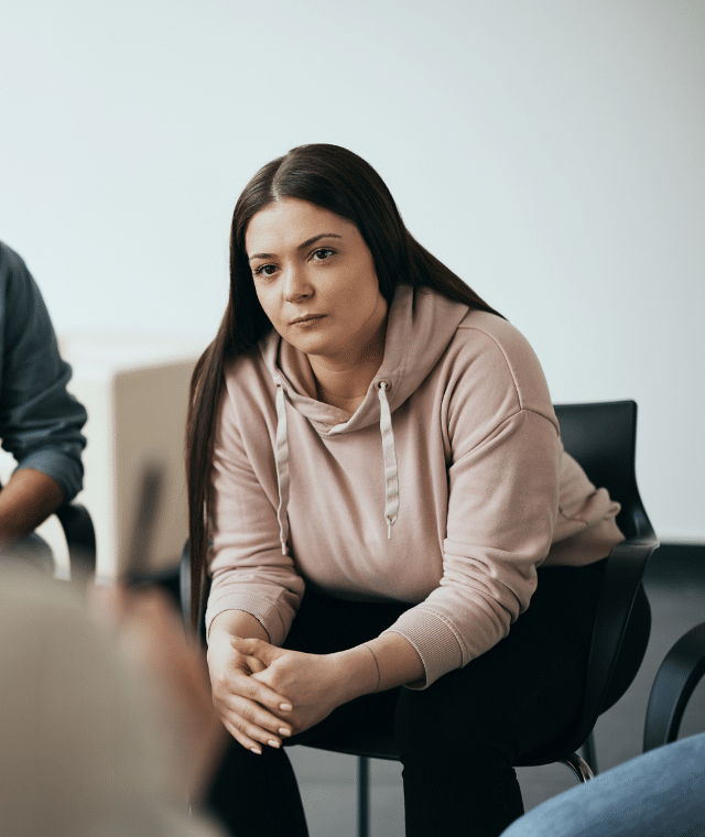 Woman sitting in a group