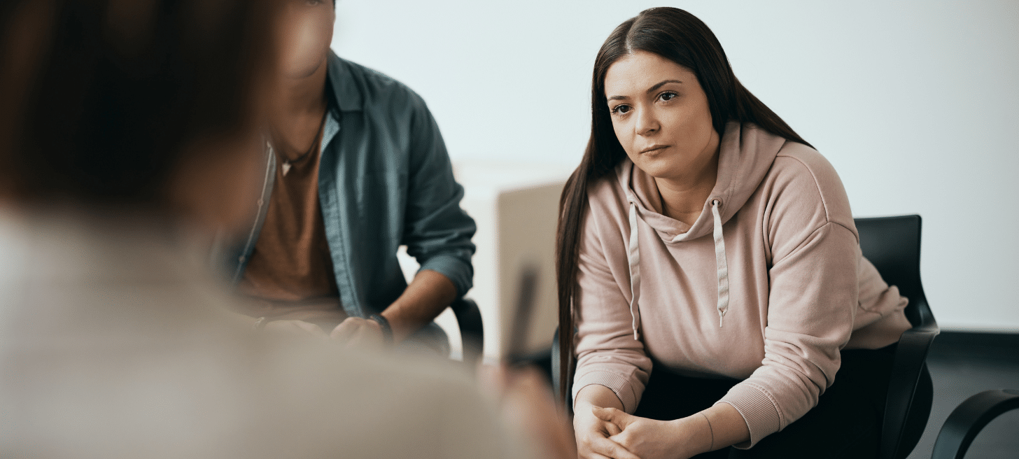 Woman sitting in a group