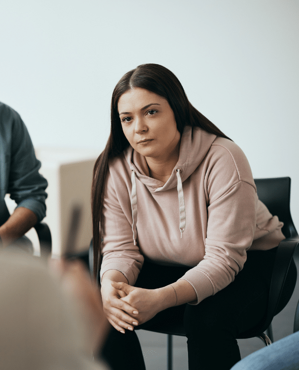 Woman sitting in a group