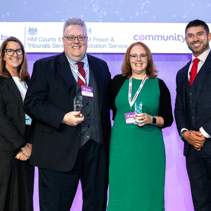 Nicola Dubay-Goodman and Adam Polkey receiving an Inspire Justice Award