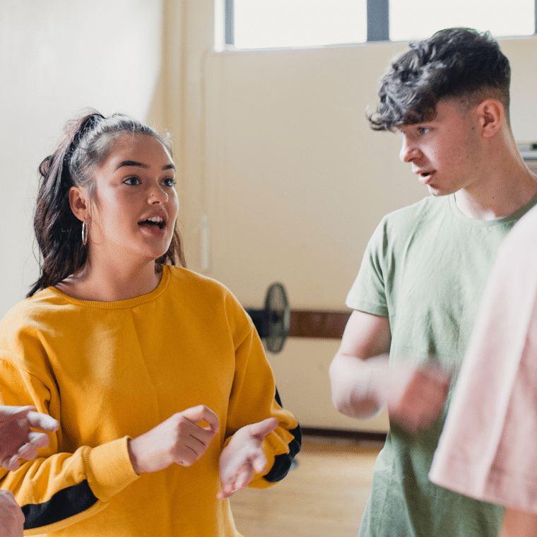 A group of young people talking together.