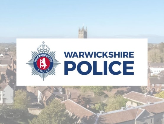 Warwickshire Police logo overlayed on an image of Warwickshire's skyline