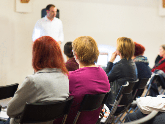 A person standing in front of a group of people presenting