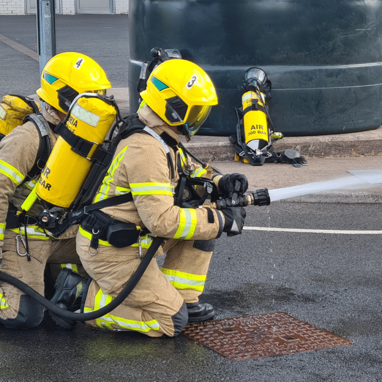 Two apprentice firefighters completing their end-point assessment