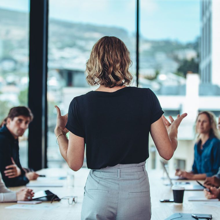 Woman leading a team meeting in an office setting