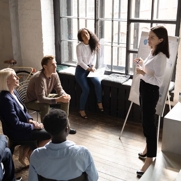 Woman leading a meeting in an office setting