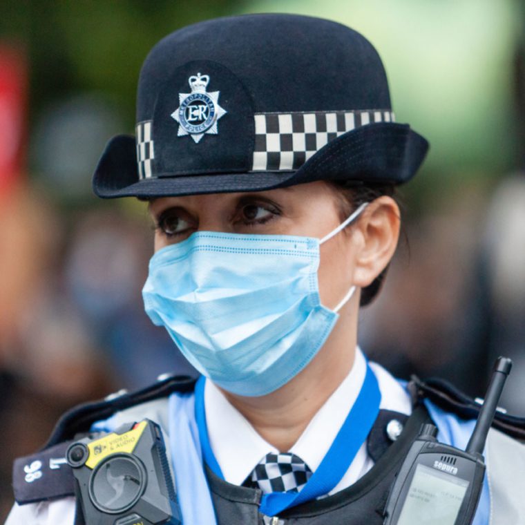 Police officer with a mask on