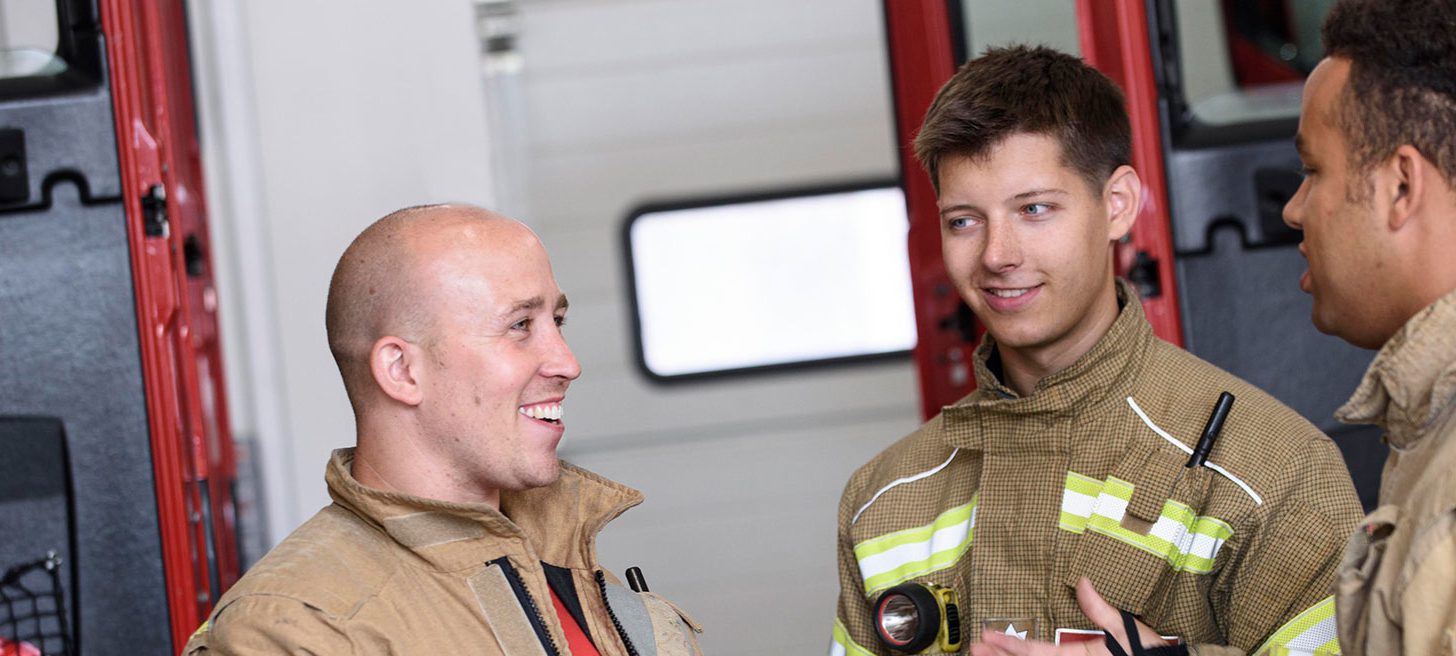 3 firefighters working together