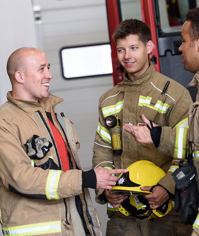 3 firefighters working together