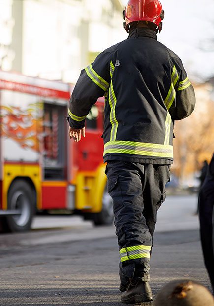 Firefighter apprentice walking towards fire engine