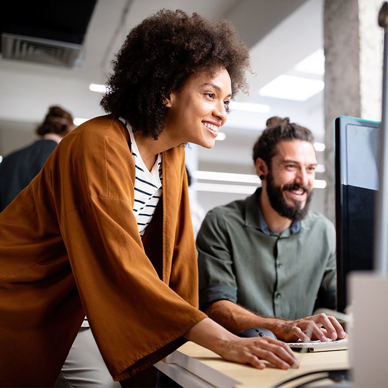 Two colleagues working in an office environment together