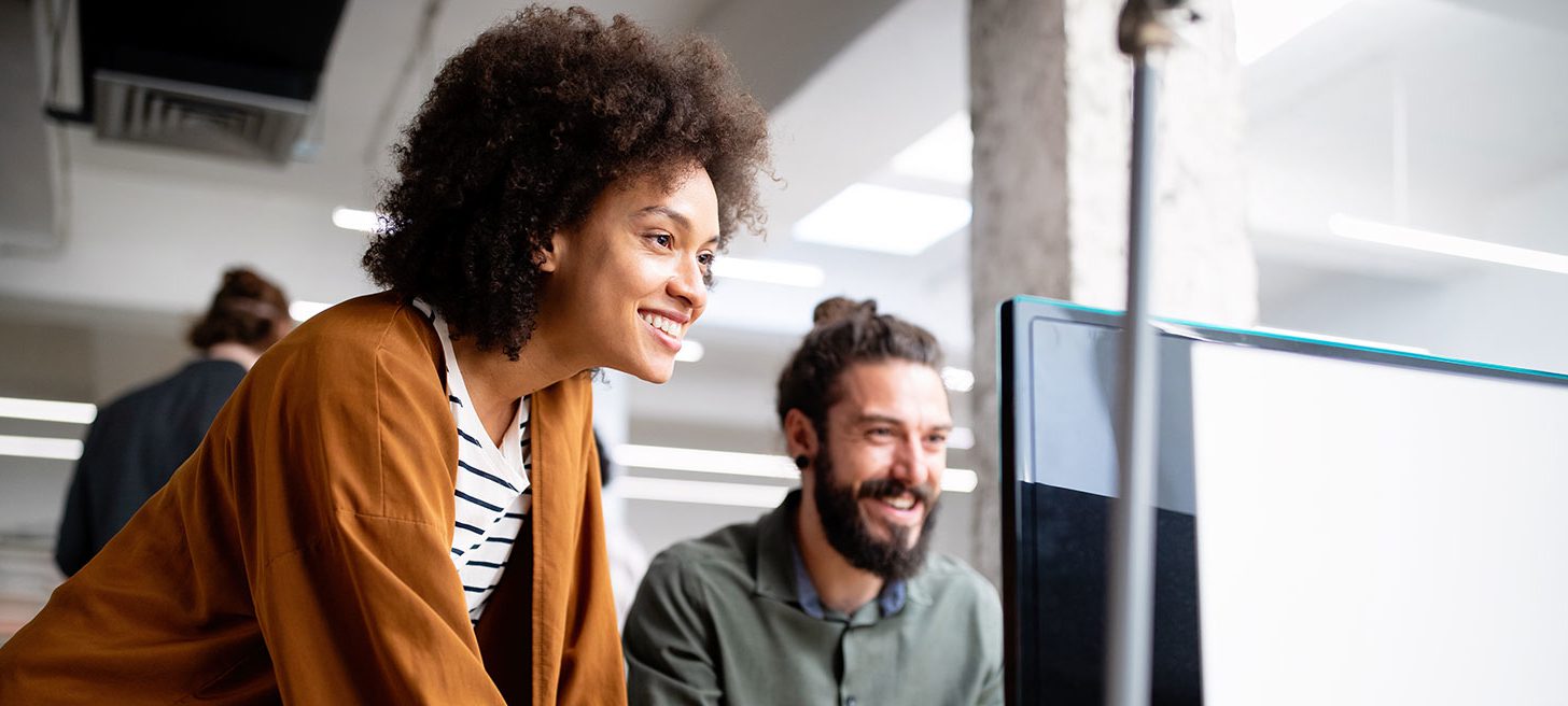 Two colleagues working in an office environment together