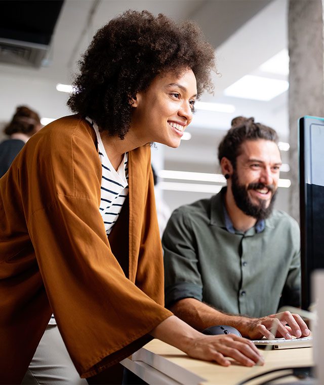 Two colleagues working in an office environment together