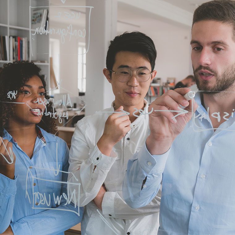 Group of colleagues working together in an office setting