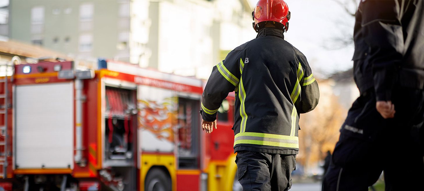 Firefighter apprentice walking towards fire engine