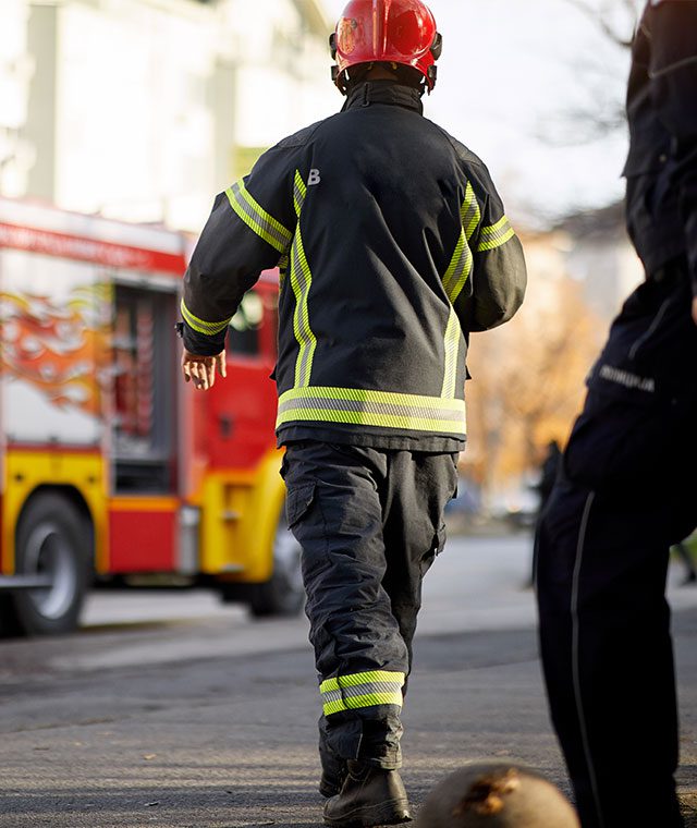 Firefighter apprentice walking towards fire engine