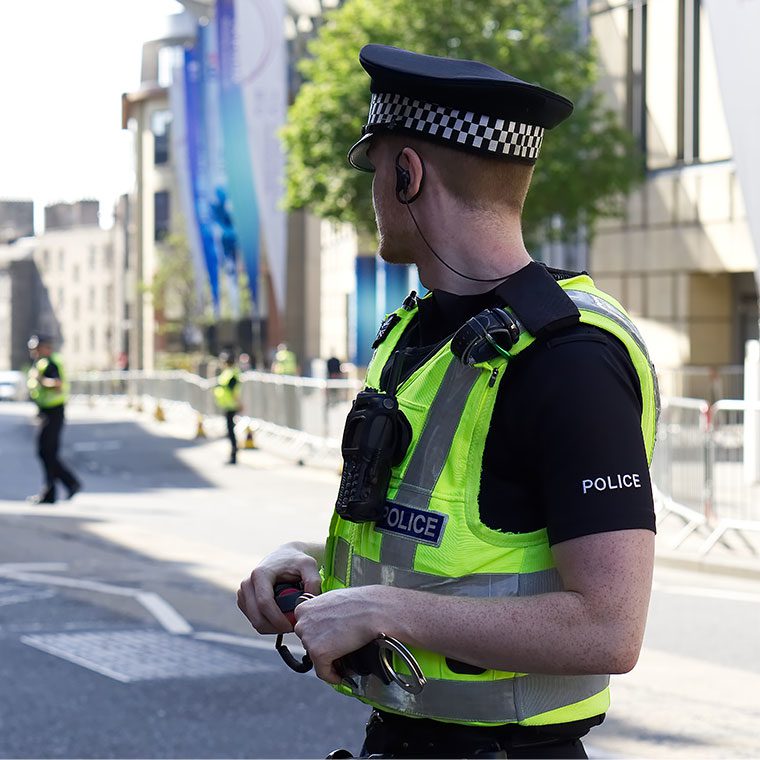 Young police officer working in uniform