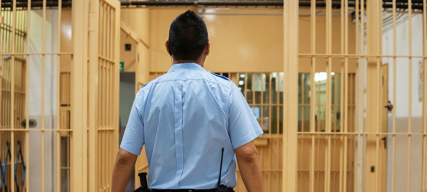Prison officer working in prison setting