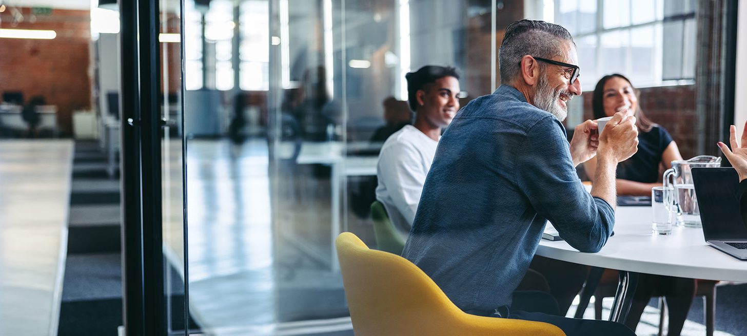 Group of individuals working in an office.