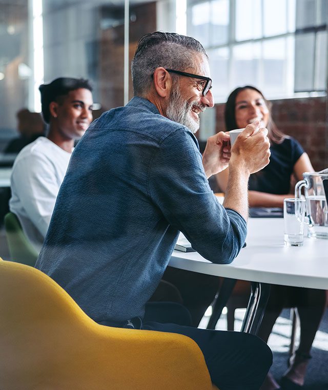 Group of individuals working in an office.