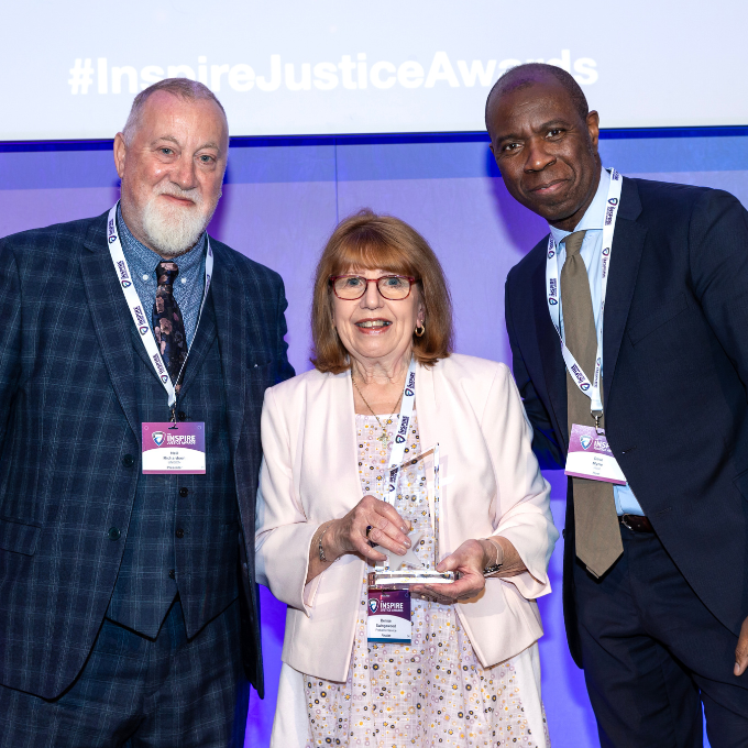 Denise Swingewood receiving an Inspire Justice Award