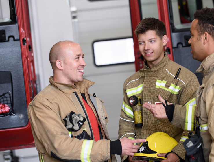 Firefighters talking at work