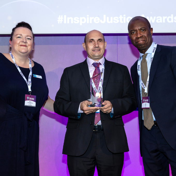 Matthew Bysouth receiving an Inspire Justice Award