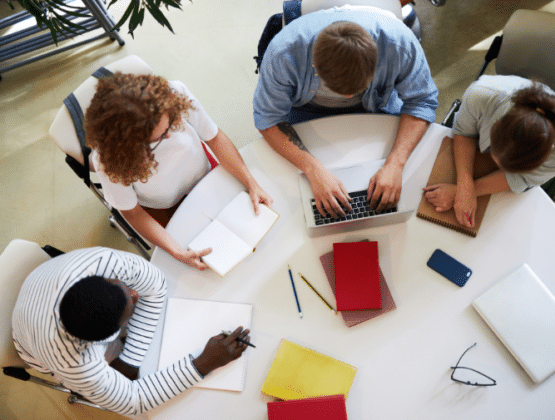 A group of people working at a table